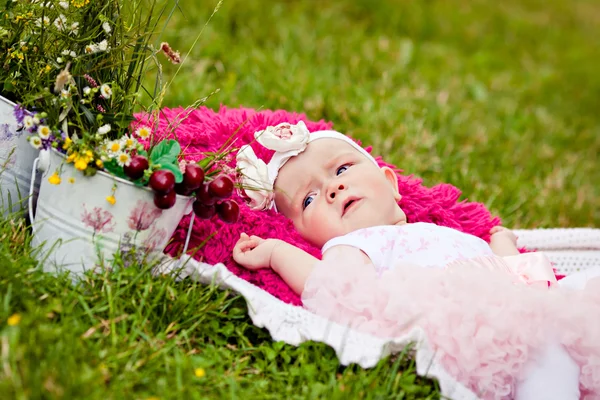 Cute newborn girl in pink skirt — Stock Photo, Image