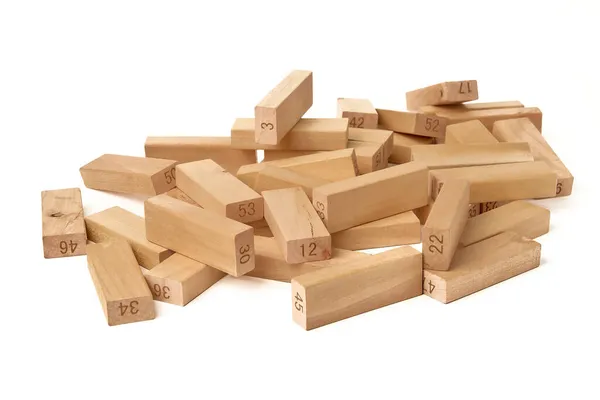 Numbered wooden blocks of the Jenga Tower board game on a white background. Home entertainment — Stock Photo, Image