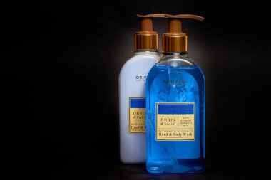 Ukraine - 01 10 2022: Liquid soap and lotion for hands and body with natural essential oils from the Oriflame company Sweden on a dark background