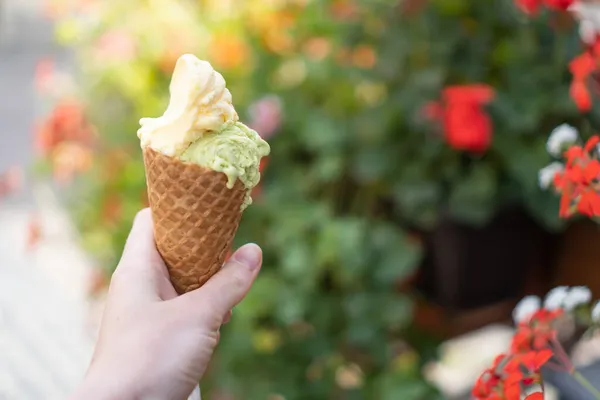 Delision gelato cone on street. Assorted flavor ice creams. Summer ice cream. Melting gelato or melted ice cream cone — Stock Photo, Image