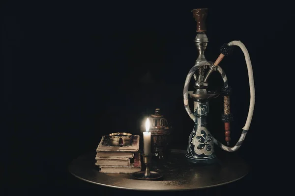 Shisha hookah together with book with candles. shisha concept. — Stock Photo, Image