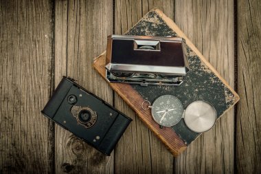 vintage travel memories concept. Old camera, binoculars, letters and map-holder with map. copy space.