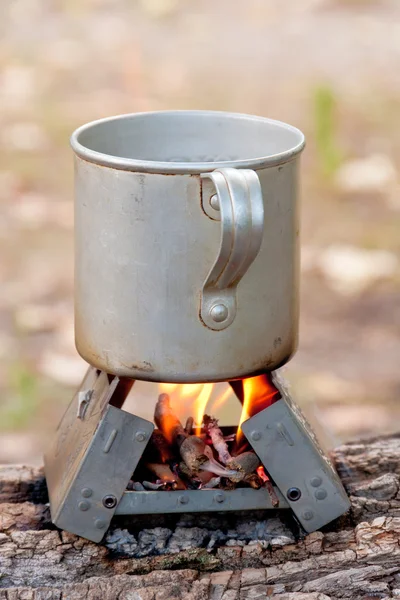 Travel mug on fire — Stock Photo, Image