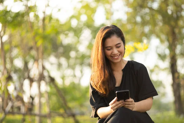 Asian Woman Mature Using Cell Phone Public Park Adult Female Fotografia Stock