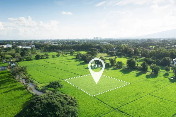 Land plot in aerial view. Real estate or property consist of empty land or green field and gps position pin point of location for development by housing construction, sale, rent, buy or investment.