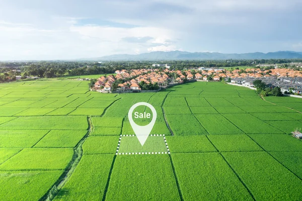 Land plot in aerial view. Real estate or property consist of empty land or green field and gps position pin point of location for development by housing construction, sale, rent, buy or investment.