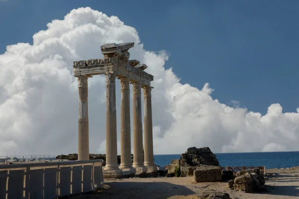 The Temple of Apollo is a Roman temple built around 150 A.D.  on the Mediterranean Sea coast.  Side Antalya Turkey. Cloudy Blue or red Sky. Selective Focus Columns.