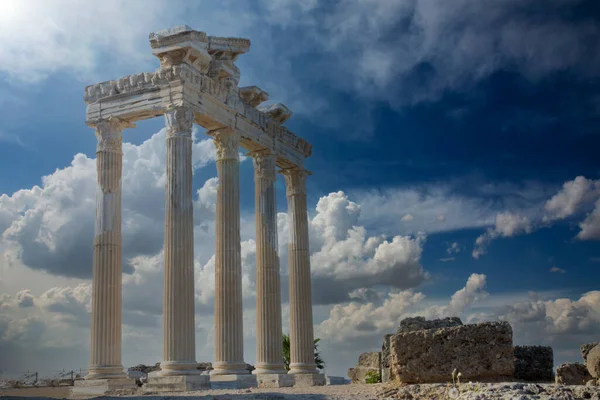 The Temple of Apollo is a Roman temple built around 150 A.D.  on the Mediterranean Sea coast.  Side Antalya Turkey. Cloudy Blue or red Sky. Selective Focus Columns.