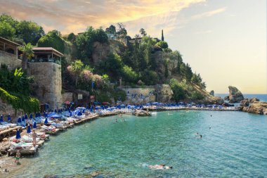 06-07-2021Antalya Kaleici.  Panorama of Antalya coast from the tall cliff with Mermerli beach, Pier of old port, modern hotels