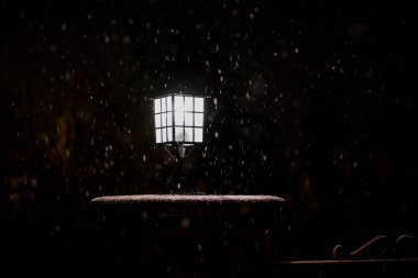 While the snowfall continues in Ankara, the decorative lighting lamp. Selective Focus Lamp. Blur motion Shot.