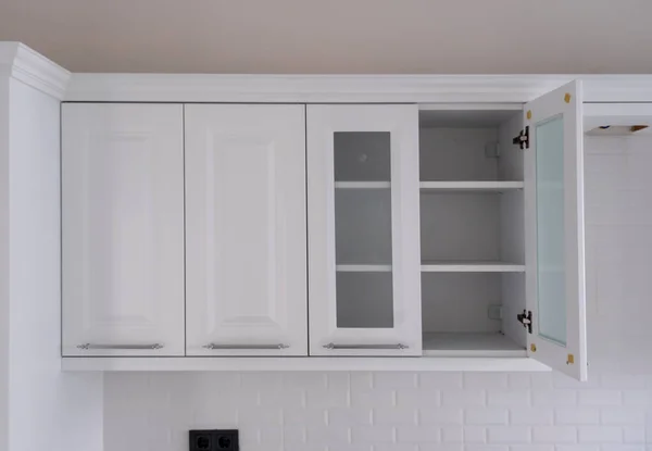 The design of the kitchen room. Kitchen cabinet with door open