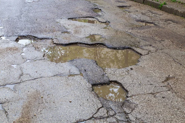Kötü engebeli yol. Metin veya yazıtlar için kopyalama alanı olan arkaplan.