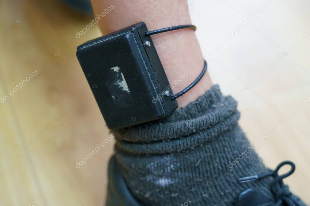 Electronic bracelet for criminals. Gadget for control and monitoring of the execution of punishment. Restriction of liberty and house arrest. Remote identification and location tracking.