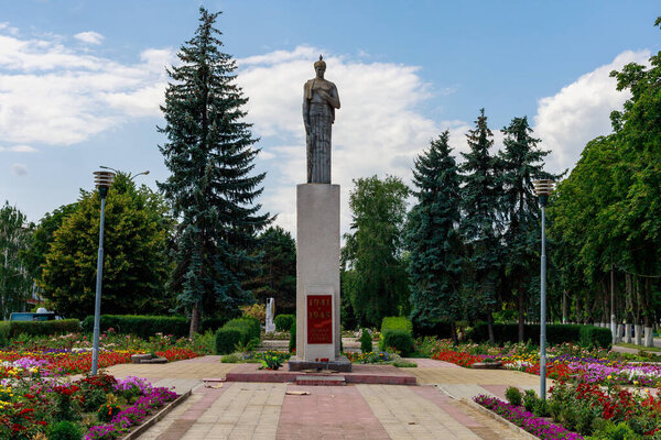 Sculpture of a woman. Monument to the victims of the Second World War. Eternal glory to the heroes. Background with copy space for text. Illustrative editorial. July 24, 2021 Briceni Moldova.