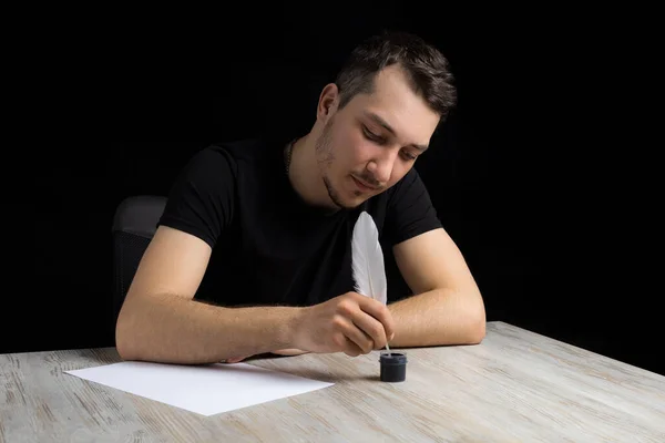 Young Shy Smiling Handsome Man Black Clothes Dips Quill Pen — Stock Photo, Image