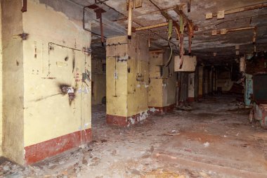 The interior of an underground anti nuclear abandoned secret military bunker. Creepy place, post apocalyptic background. clipart