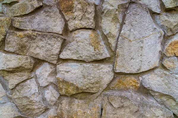 野生の装飾石で作られたラフテクスチャ壁表面 仕上げ作業のための人気素材 テキストやレタリングのためのコピースペースと自然な背景 — ストック写真