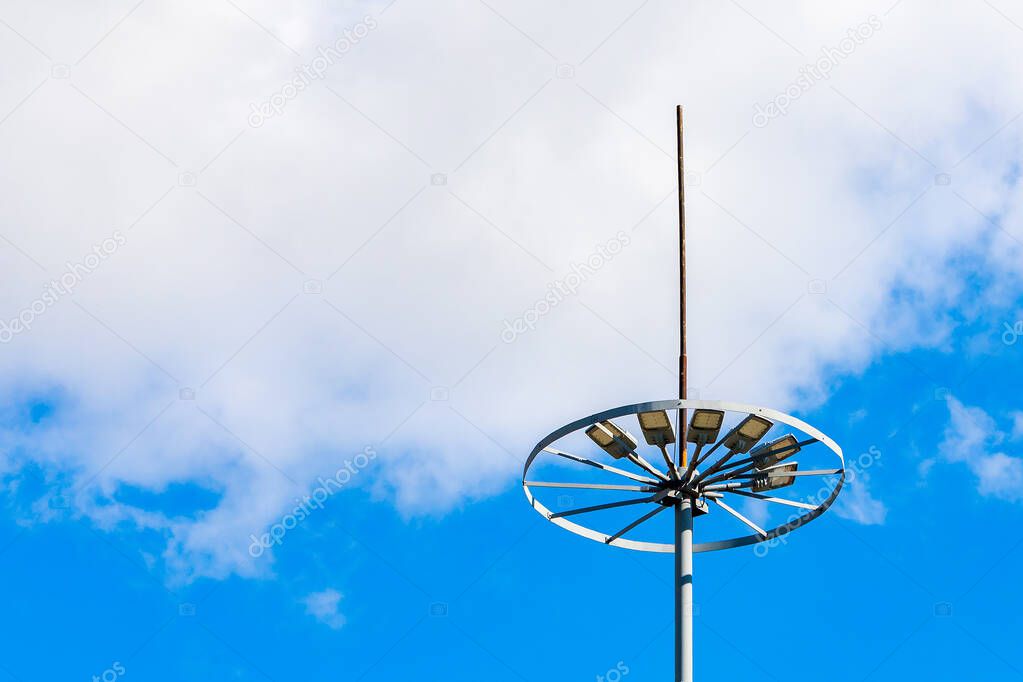 Lightning rod on the lighting pole. Protecting citizens from lightning strikes during a thunderstorm or storm. Safe urban environment. Background with copy space for text