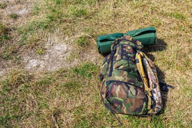 Tourist backpack in green khaki color and copy space for text, background