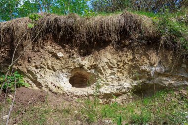 Quarry for manual extraction of clay in the village for the production of adobe or raw pottery. Background with copy space for text