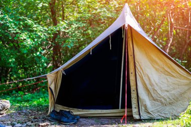 Old canvas tent tourist in nature. Background with copy space for text
