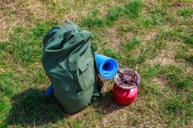 Tourist backpack in green khaki color and copy space for text, background