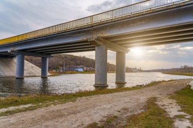 Automobile bridge over a small river. Background with copy space for text