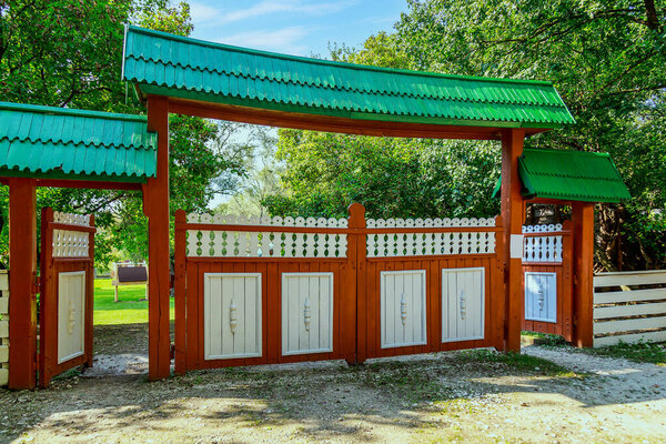 Wooden village gates. Eco tourism concept. Background with copy space for text or lettering