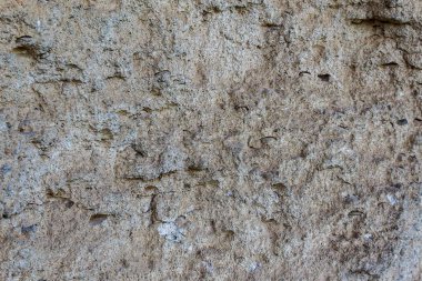 Doğadaki vahşi doğal taşın kaba dokulu yüzeyi. Arkaplan veya kopyalama alanı