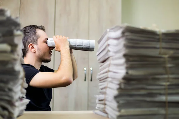 Man Holding Two Twisted Roll Newspaper Metaphor Allegory Binoculars Selective — Stock Photo, Image