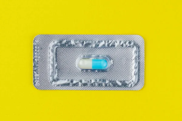 Blister Pack One Very Important Expensive Tablet Pill Yellow Background — Stock Photo, Image