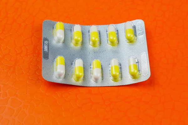 Blister Pack Ten Medical Tablets Pills Orange Background Selective Focus — Stock Photo, Image