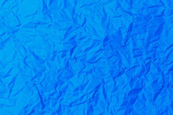 レトロな古いヴィンテージの古典的なグランジペーパーのラフなしわの質感の表面 背景や背景 設計は空白だ 純粋な青またはほとんど純粋な青 — ストック写真