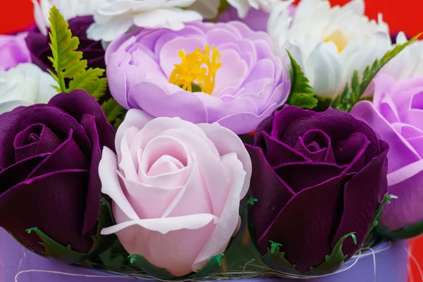 Artificial flowers made from soap. Gift bouquet with selective focus. Congratulations on the birthday of a girl or a holiday for women. Wedding and engagement. Close-up background.