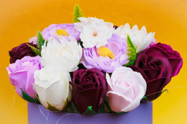 Artificial flowers made from soap. Gift bouquet with selective focus. Congratulations on the birthday of a girl or a holiday for women. Wedding and engagement.