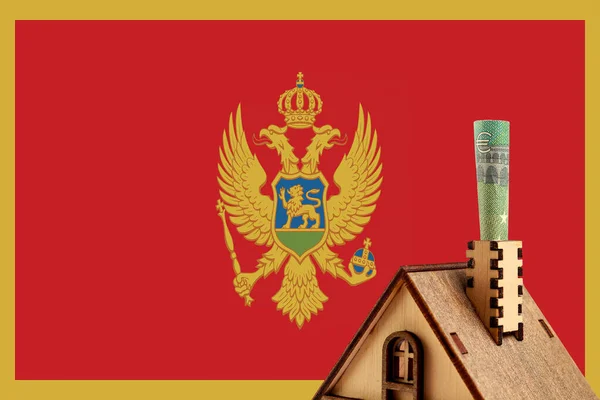 Eurosedel Skorsten Trä Leksak Symboliskt Hus Mot Bakgrund Montenegro Flaggan — Stockfoto