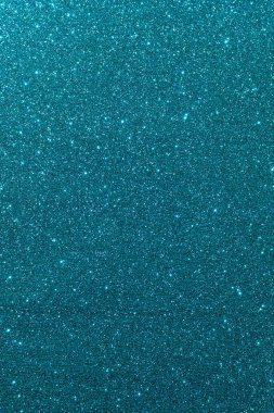 Işıltılı bir arka plan. Arkaplanda simler var. Parlak desenli yüzey. Dikey görüntü. Koyu renkli. Yumuşak ışık