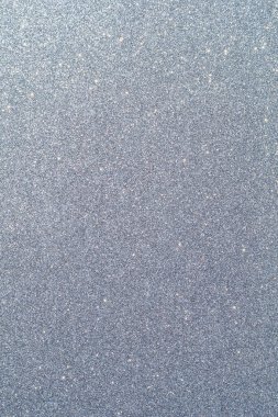 Işıltılı bir arka plan. Arkaplanda simler var. Parlak desenli yüzey. Dikey görüntü. Gri mavi. Yumuşak ışık