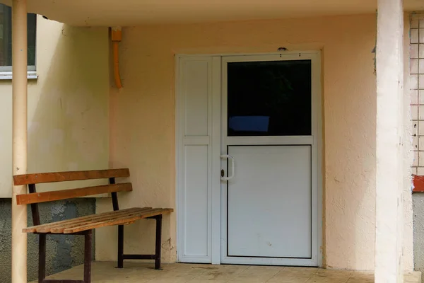 Plastic door to the entrance of an apartment building. Background with copy space for text