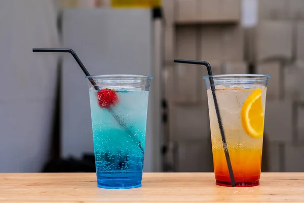 Close Two Fruity Cooling Refreshing Cocktails Transparent Disposable Glasses Straws — Fotografia de Stock