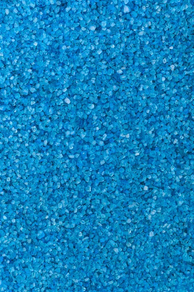 Texture of sea aromatic salt. Spa and relaxation concept. Background or backdrop. Blank for design or copy space for a designer. Vertical image.