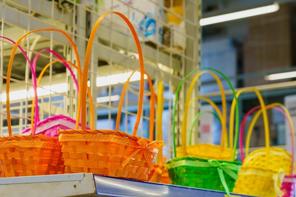 Wicker baskets on a store shelf. Background with copy space for text