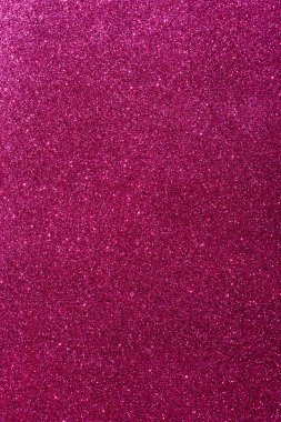 Işıltılı bir arka plan. Arkaplanda simler var. Parlak desenli yüzey. Dikey görüntü. Koyu pembe. Karışık neon ışığı