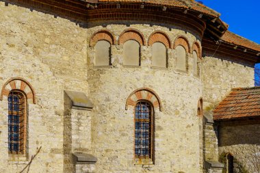 Windows of an ancient stone building of classical architecture. Background with selective focus and copy space for text