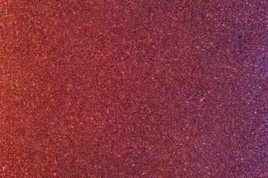 Işıltılı bir arka plan. Arkaplanda simler var. Parlak desenli yüzey. Koyu kırmızı. Karışık neon ışığı