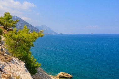Very beautiful rocky Turkish Mediterranean coast in Beldibi district of Kemer, Antalya province in Turkey. Background or landscape