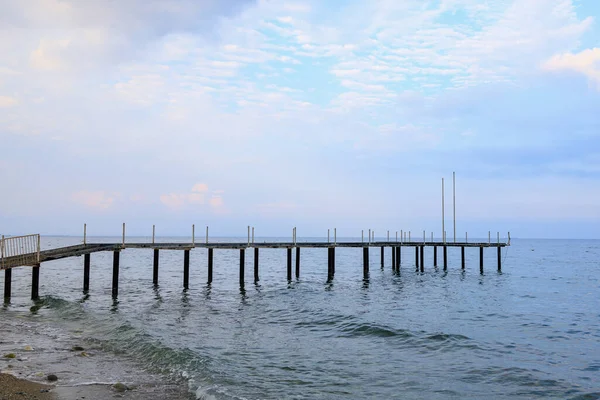 Old pier on the public central beach. Background with copy space for text