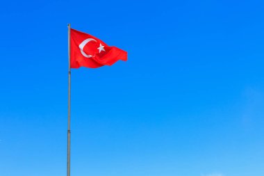 Turkish flag against the sky. The official name of the state is the Republic of Turkey, the capital is Ankara. Background with copy space