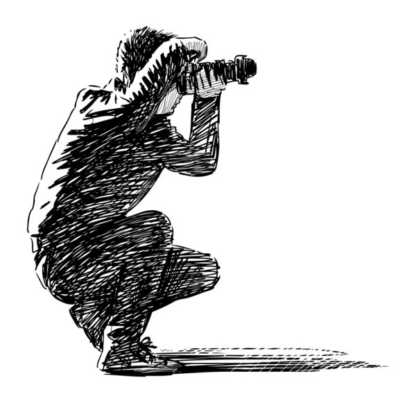 Фотограф делает фотографии
