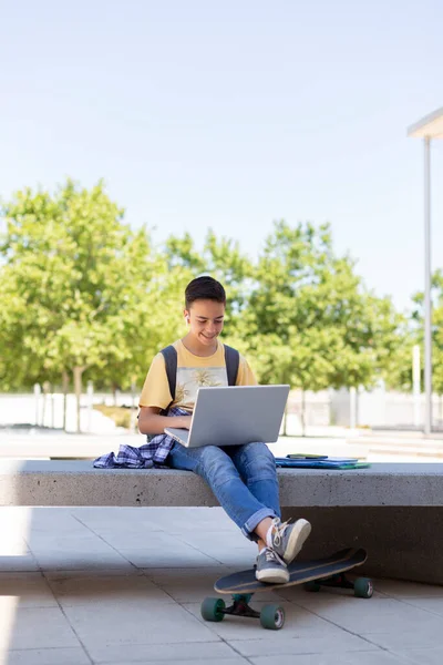 Caucasian Teenage Boy Using Laptop Outdoors Back School Space Text — Foto de Stock